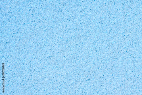 Blue background, rough sponge texture, macro shot design