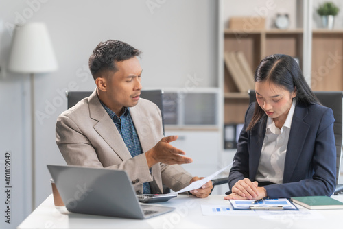 Asian businesswoman and businessman facing workplace challenges. From age diversity to handling mistakes and consequences like bankruptcy, emphasizing accountability, and learning from errors.