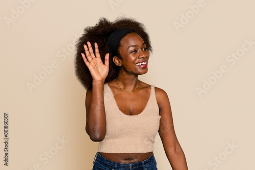 African American woman waving her hand