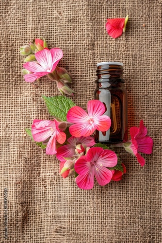 geranium essential oil on burlap background