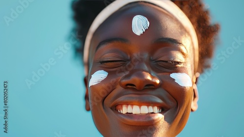 Black woman, facial cream and skincare wellness of happy face skin glow and sunscreen. Cosmetic, collagen and dermatology lotion of a woman model with a smile from natural cosmetics treatment