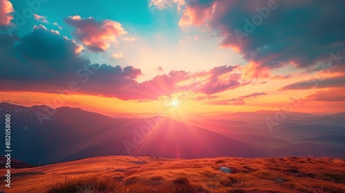 Epic sunset landscape sky with big bright sun going behind the mountains
