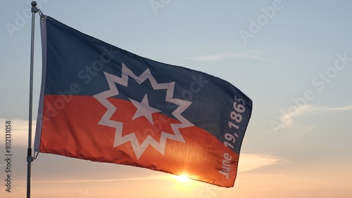 Juneteenth Flag, Juneteenth National Independence Day, Celebration Freedom Day, Happy African-American holiday June 19. Juneteenth flag waving against the wind over sunset, cloudy sky background