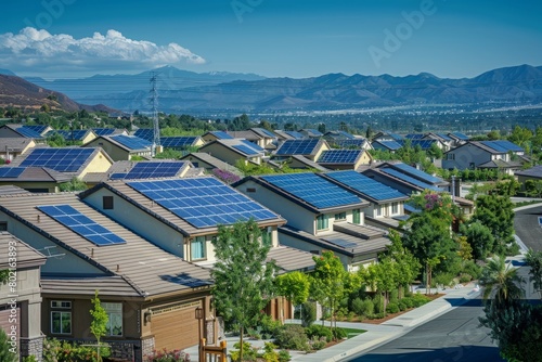 Row of houses in a neighborhood with solar panels on rooftops, showcasing widespread adoption of renewable energy technology