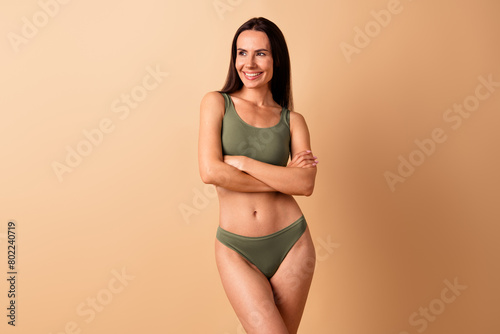 Photo of sporty lady coach crossed arms look on empty space adverts isolated pastel color background