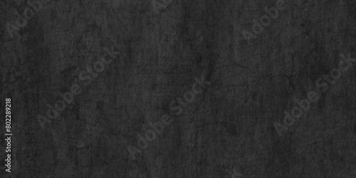 vintage distressed grunge texture with black charcoal wall surface, Rough Black wall slate texture of old grunge wall, dark Black textured grunge background, black chalk board or blackboard texture.