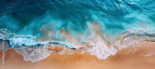 beach with clear blue water and waves gently lapping at golden sand wallpaper