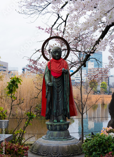 Japan statues festival goers buildings 