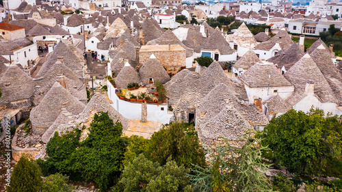 The traditional Trulli houses in Alberobello city, Apulia, Italy. Cityscape over the traditional roofs of the Trulli, original and old houses of this region, Apulia, Alberobello, Puglia, Italy.