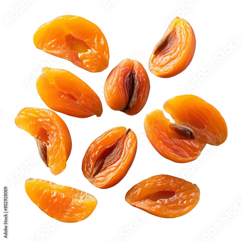 Dried apricot halves plump and slightly wrinkled scattered casually on a transparent background Food and