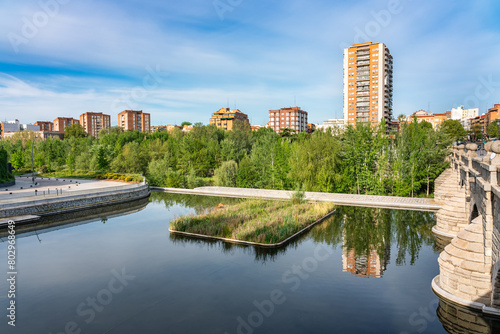 Cityscape of the city of Madrid next to the Manzanares River that crosses the south of the city, Spain.