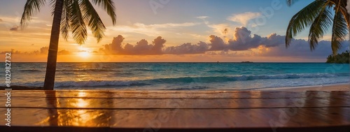 long wooden table with Beautiful bright sunset on a tropical paradise beach