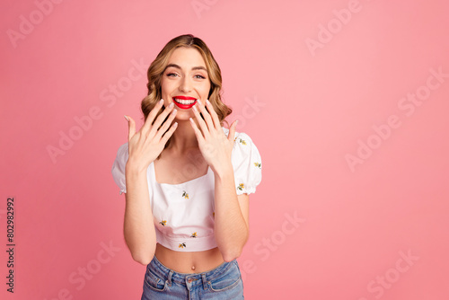 Photo portrait of lovely young woman cover mouth amazed dressed stylish white garment hairdo isolated on pink color background