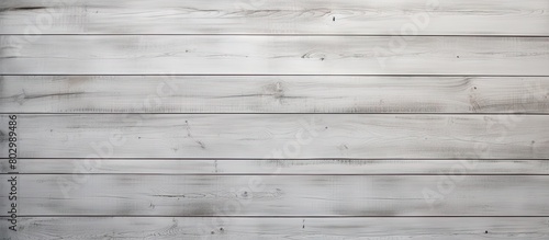 A copy space image of a vintage white wooden wall background seen from the top in a front view The wall is made of gray painted planks and boards creating a gray backdrop