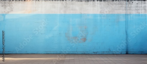 A copy space image of the Argentinian flag displayed proudly on a clean and smooth white concrete wall