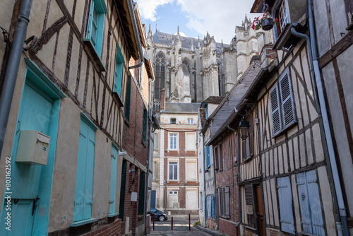 Beautiful street with traditional French buildings with wooden beams and colorful, surroundings of La Cathédrale Saint-Pierre, Beauvais, France.