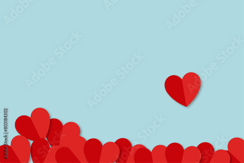 red paper hearts on a blue background. love. background