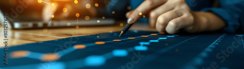 Close up of businesswoman analyzing financial data and graphs on desk.