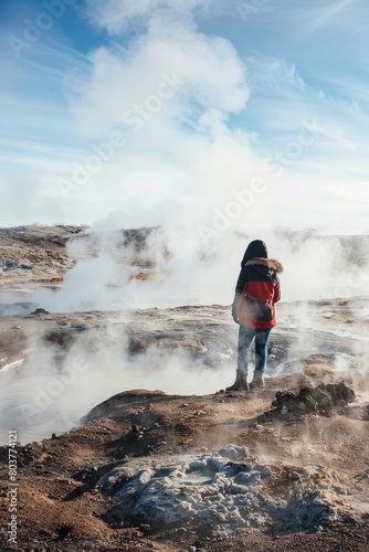 Wander through a field of volcanic vents, where geysers shoot high into the air and hot springs bubble and churn amidst the barren, Generative AI