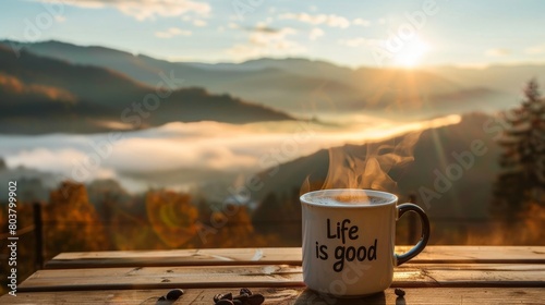 Serene Sunrise Scenery with Inspirational Mug Overlooking Misty Mountains. Horizontal banner with motivational phrases on the cup "Life is good", copy space