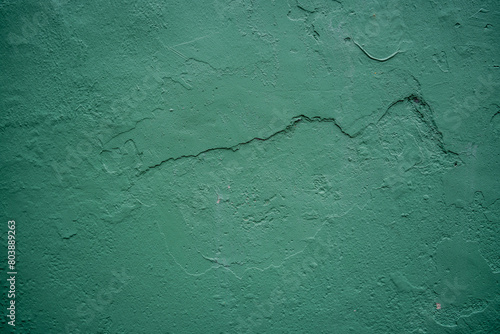 Close-Up View of a Green Textured Wall with Cracks in Malacca in Malaysia