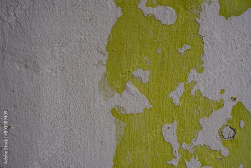 Texture of Green Peeling Paint on Rough White Wall in Malacca in Malaysia