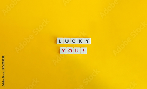 Lucky You Phrase. Text on Block Letter Tiles on Yellow Background. Minimalist Aesthetics.