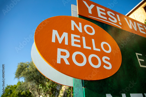 A round sign stating No Mello Roos .at a new home development