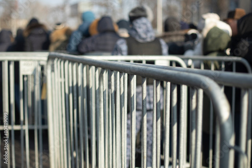 Steel Fence At Concert. Fences from the crowd. Mass gathering of people in children's rooms.