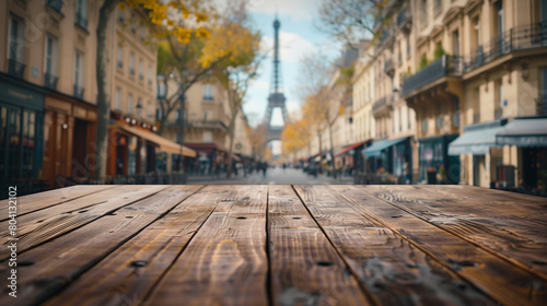 A photo shows an empty wooden table top with a slightly blurry background of the Eiffel Tower, Ai Generated Images