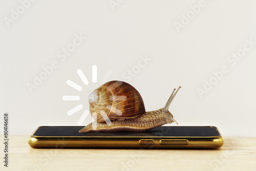 Snail with loading sign on smartphone - Concept of slow Internet speed and slow progress loading bar