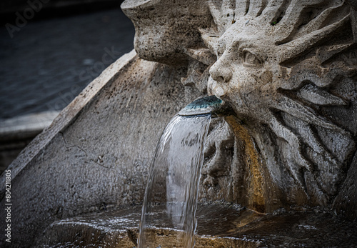 Carved fountain at the famous Spanish Steps piazza in the city of Rome, Italy.