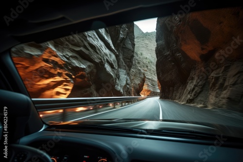 Drive through a canyon with headlights bouncing off the walls.