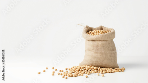 A burlap sack overflowing with soybeans on a clean white background, depicting a simple and natural look.