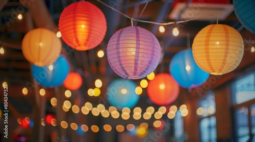 Colorful paper lanterns and string lights hang from the ceiling adding a whimsical touch to the space.