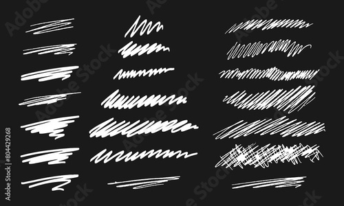Twenty one handwritten doodles. Collection of randomly drawn white squiggles on a black background. Vector set