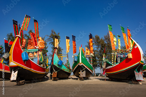 Traditional Wooden Fishermen's fishing boat, Inani Beach, Coxs bazar, Bangladesh. Colorful Wooden Fishing Boat On a Cox's Bazar Sea Beach With Blue Sky Background in Bangladesh.