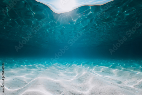 Tropical blue ocean with white sandy sea bottom underwater in Hawaii