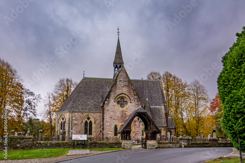 Luss parish Church of Scotland in a colorful cloudy autumn day