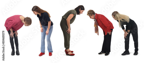 group of woman crouching looking at the ground on white background