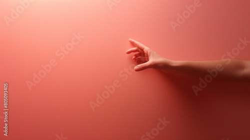 A hand reaching out to a wall