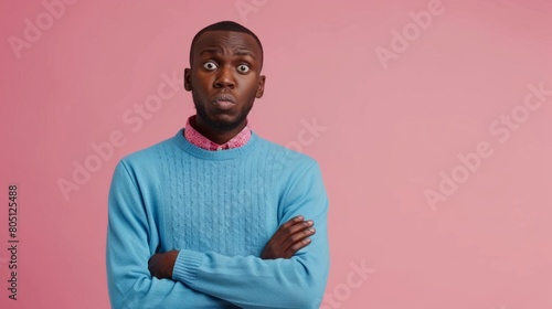 puzzled african american man in blue sweater in amazement on pink isolated background, confused and stunned man hyper realistic 