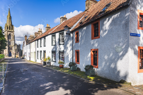  View of old houses and parish church in historic village of Falkland in Fife, Scotland, UK .