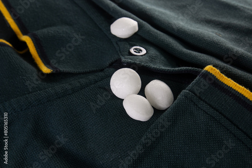 White naphthalene balls on cloth.