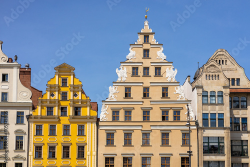 Beautiful colorful facades of antique building at Wroclaw, Poland. Polish landmark in the historic center of town. Clear blue sky