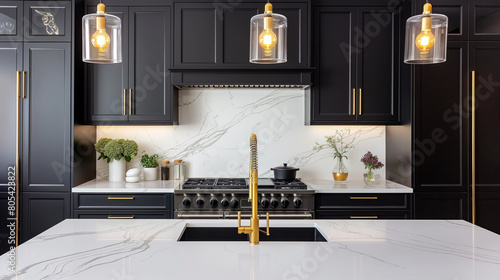 A kitchen with a white countertop and black cabinets