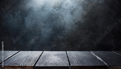 empty black table top with dark concrete rough background subtle lighting