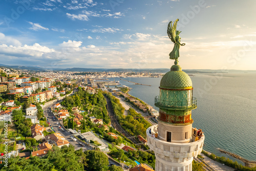 Faro della Vittoria lighthouse in Trieste city at sunny day, Italy