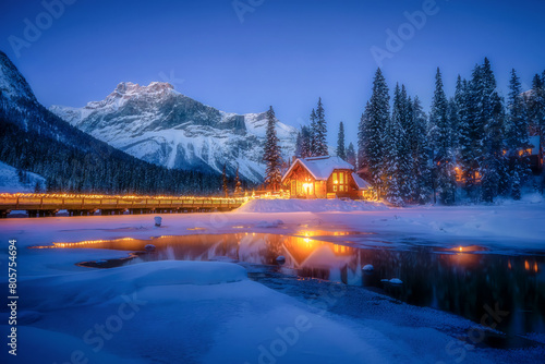 Beautiful mountain view with Emerald lake in Canada during winter time. Almost of entire lake has frozen over because of minus temperatures of weather condition.
