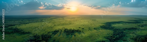 Aerial view of a vast and protected national park with a stunning sunset over the boundless savanna landscape